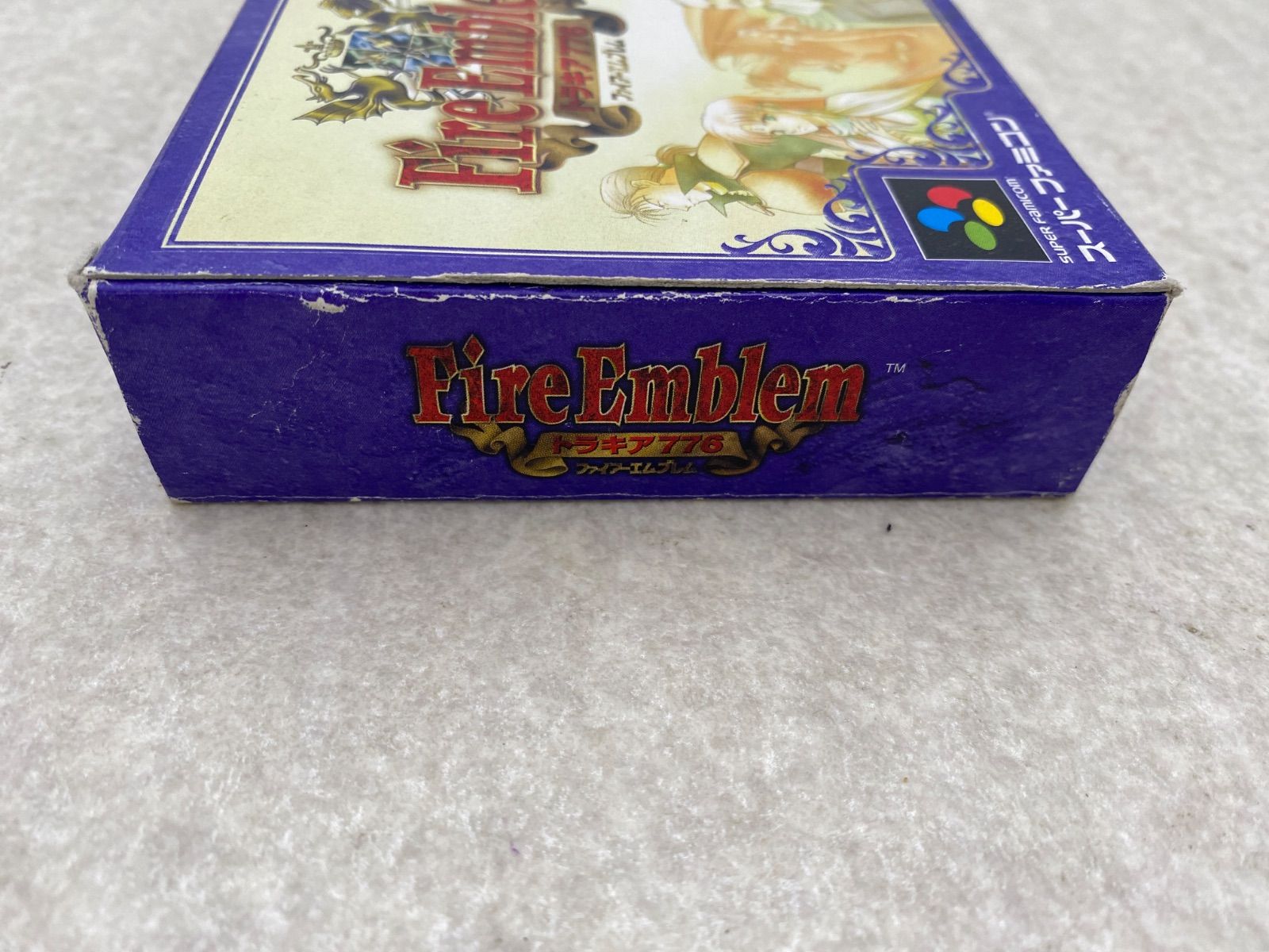 Fire Emblem Thracia 776 SNES game cartridge with damaged box and condition notes