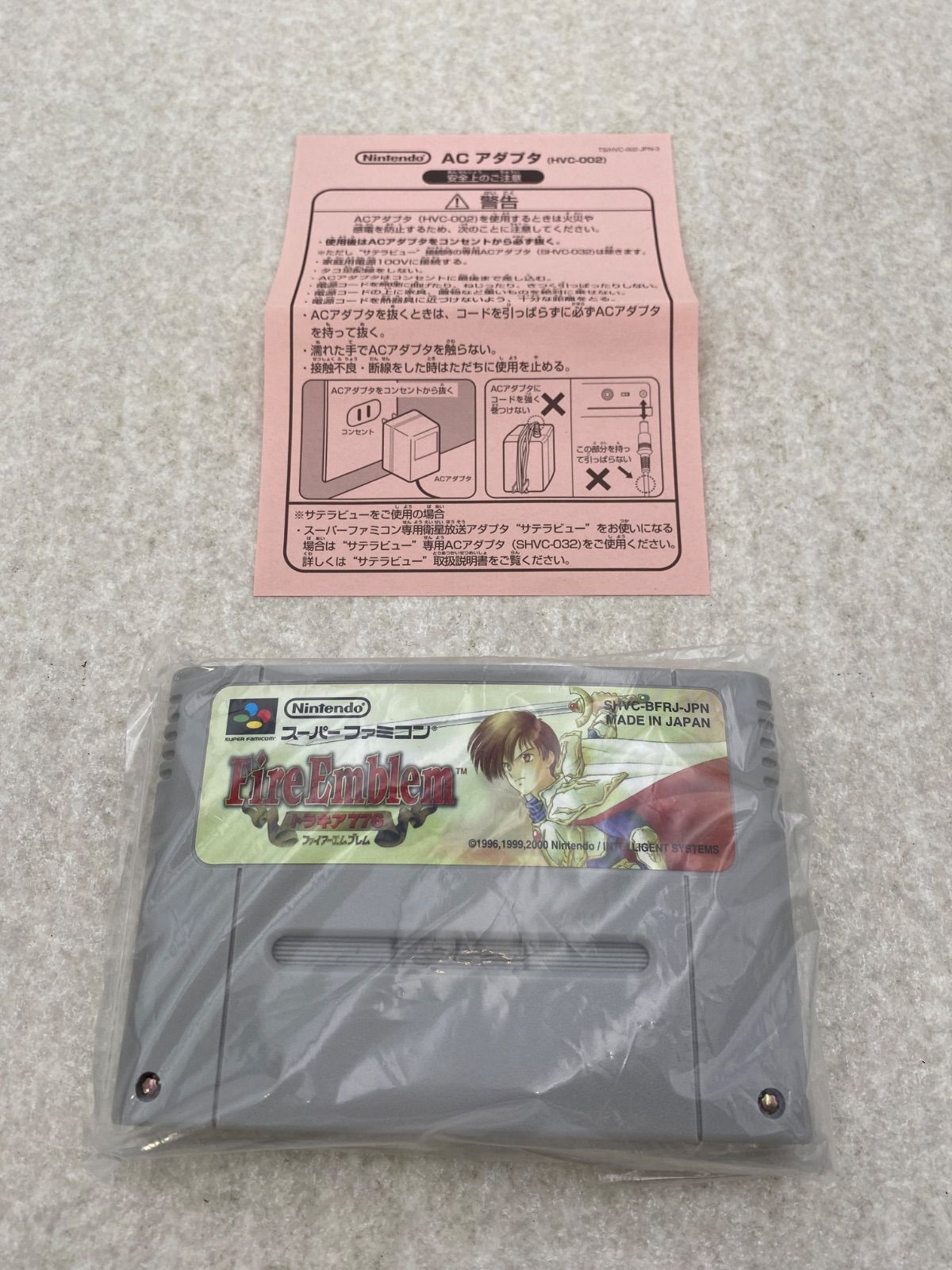 Fire Emblem Thracia 776 SNES game cartridge with damaged box and condition notes