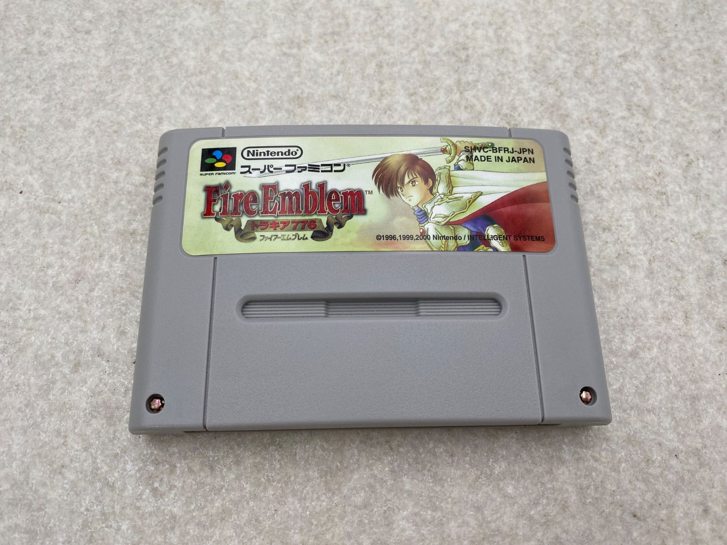 Fire Emblem Thracia 776 SNES game cartridge with damaged box and condition notes