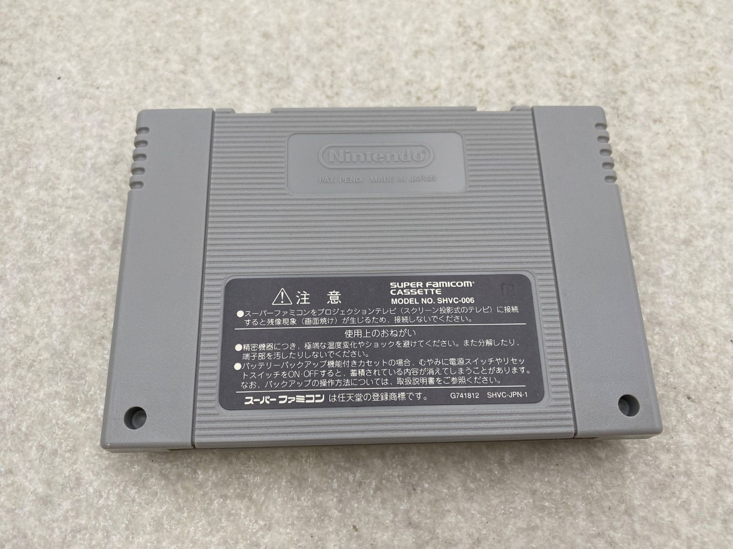 Fire Emblem Thracia 776 SNES game cartridge with damaged box and condition notes