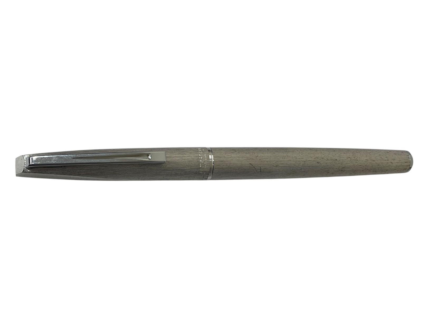 Waterman 18K 750 Mark French silver pen nib, 13.5 cm long, showing signs of wear and ink depletion
