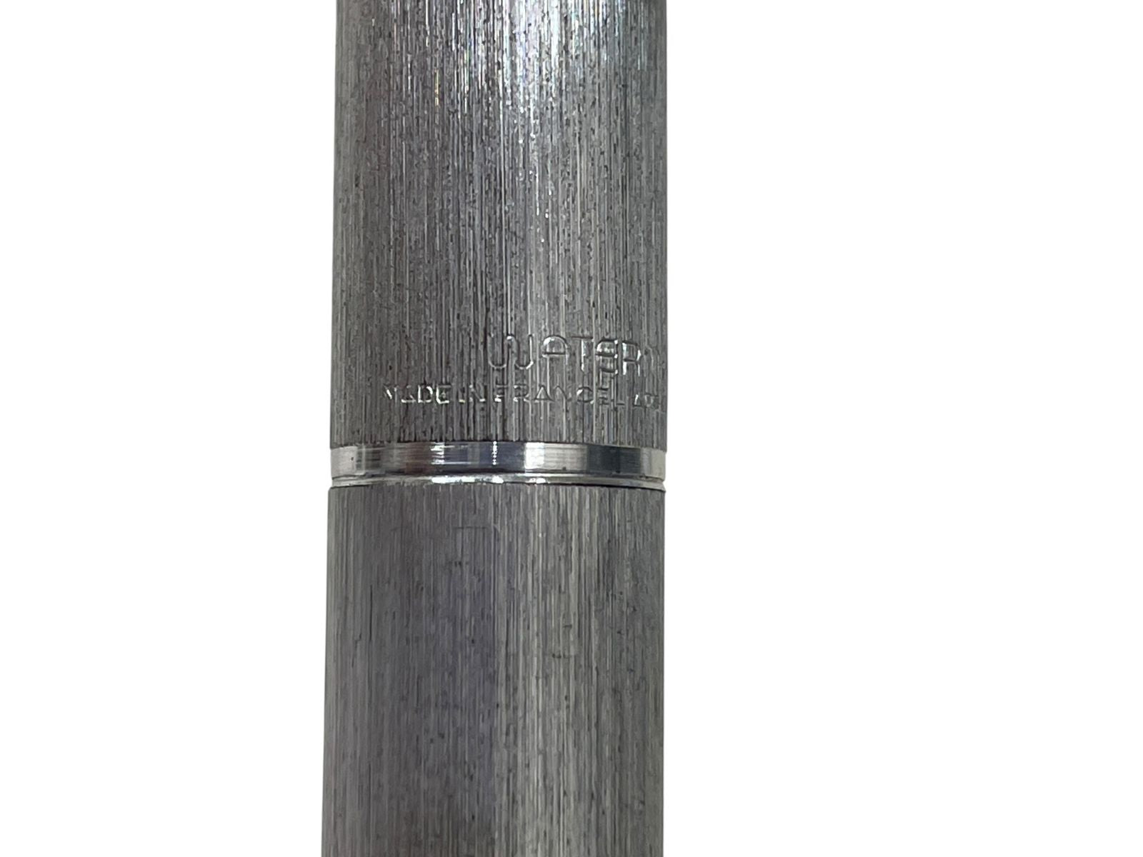 Waterman 18K 750 Mark French silver pen nib, 13.5 cm long, showing signs of wear and ink depletion