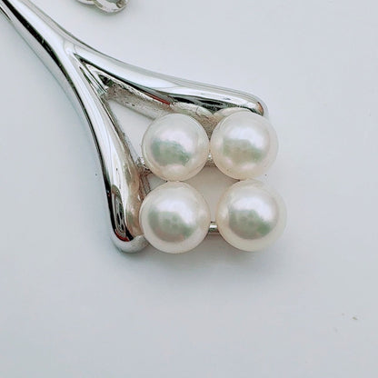 Mikimoto necklace with a 4.9mm baby pearl pendant and 40.5cm chain in silver tone