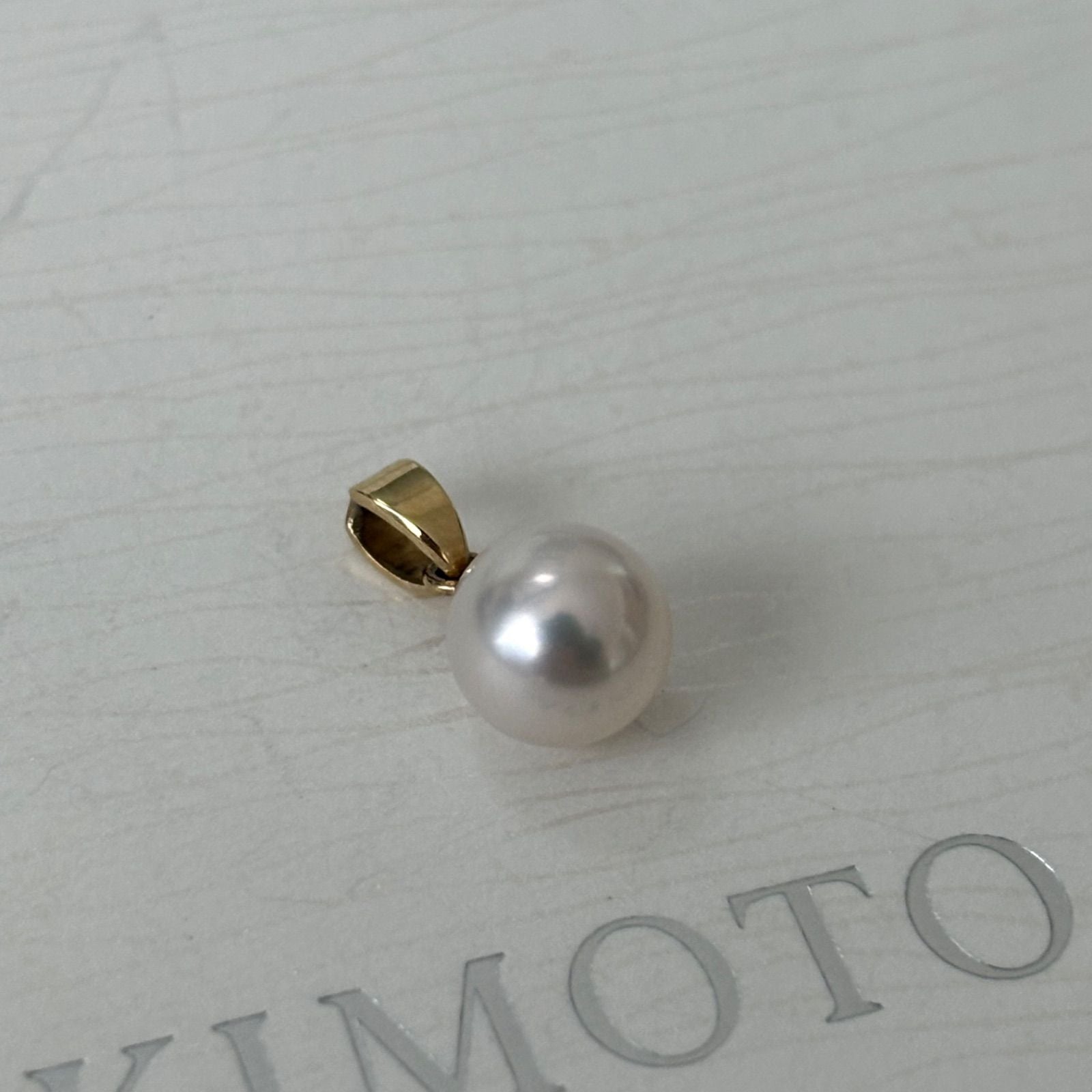 453 Mikimoto necklace featuring a 7.8mm pearl set in K14 gold top