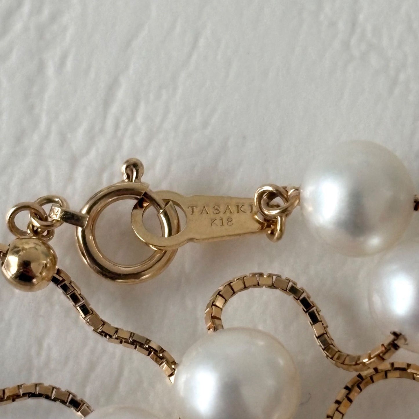 Tasaki K18 pearl necklace with 16 round beads, 44.5cm slide chain, pearls sized 6.5-7.0mm