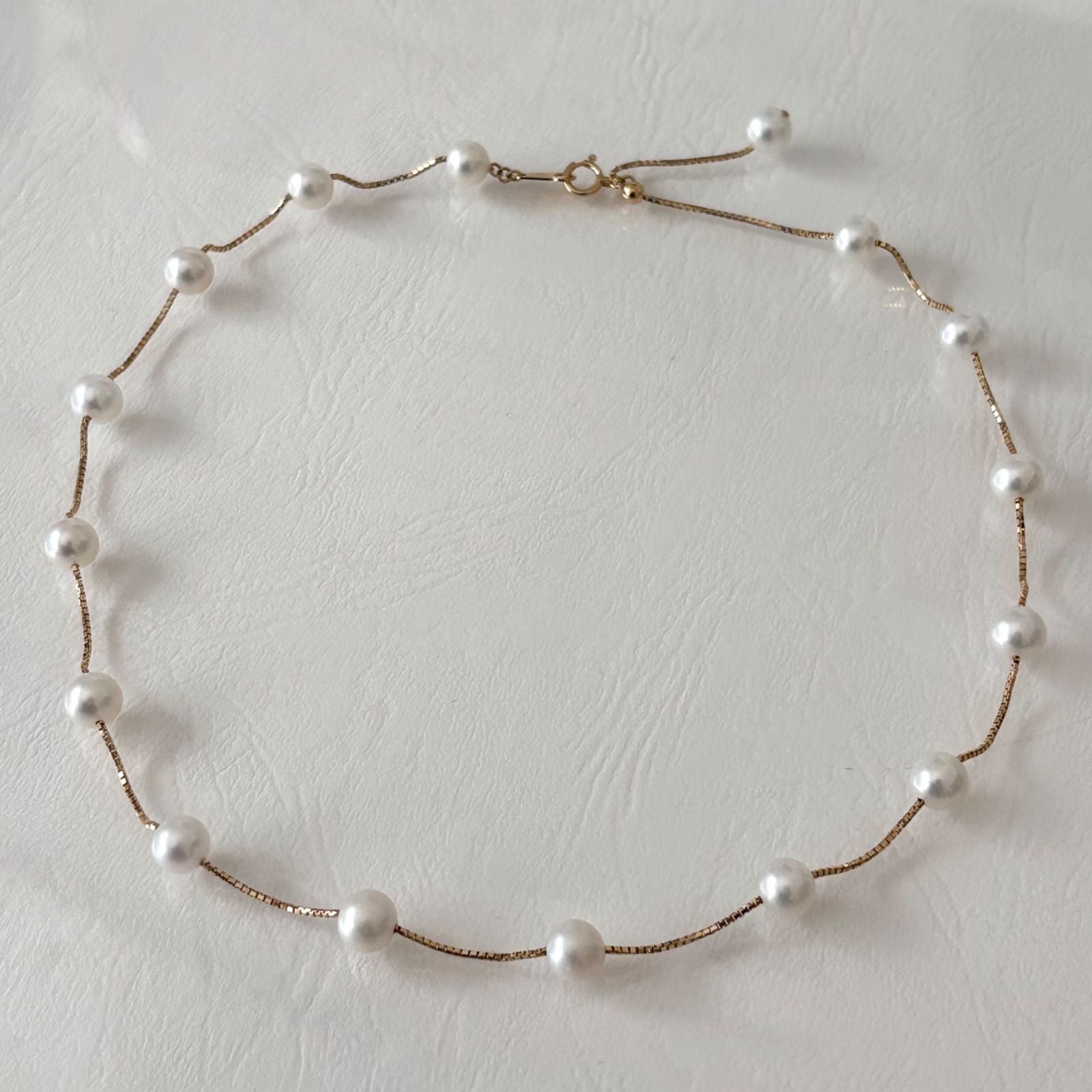 Tasaki K18 pearl necklace with 16 round beads, 44.5cm slide chain, pearls sized 6.5-7.0mm