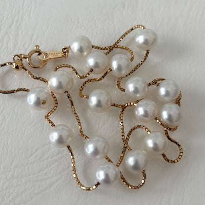Tasaki K18 pearl necklace with 16 round beads, 44.5cm slide chain, pearls sized 6.5-7.0mm
