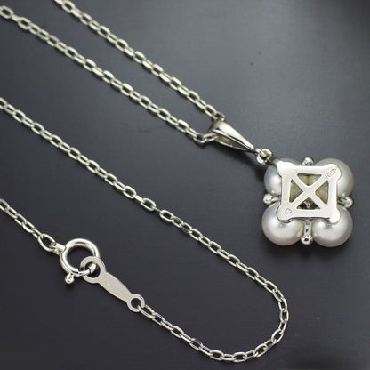 Mikimoto K18WG necklace featuring 4 Akoya pearls and a diamond pendant measuring 22mm by 13mm