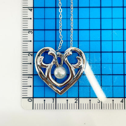 Micimoto silver necklace with a pearl heart pendant, showcasing a 3WAY design and delicate craftsmanship