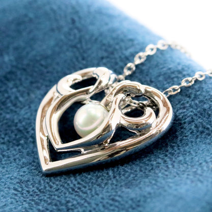 Micimoto silver necklace with a pearl heart pendant, showcasing a 3WAY design and delicate craftsmanship