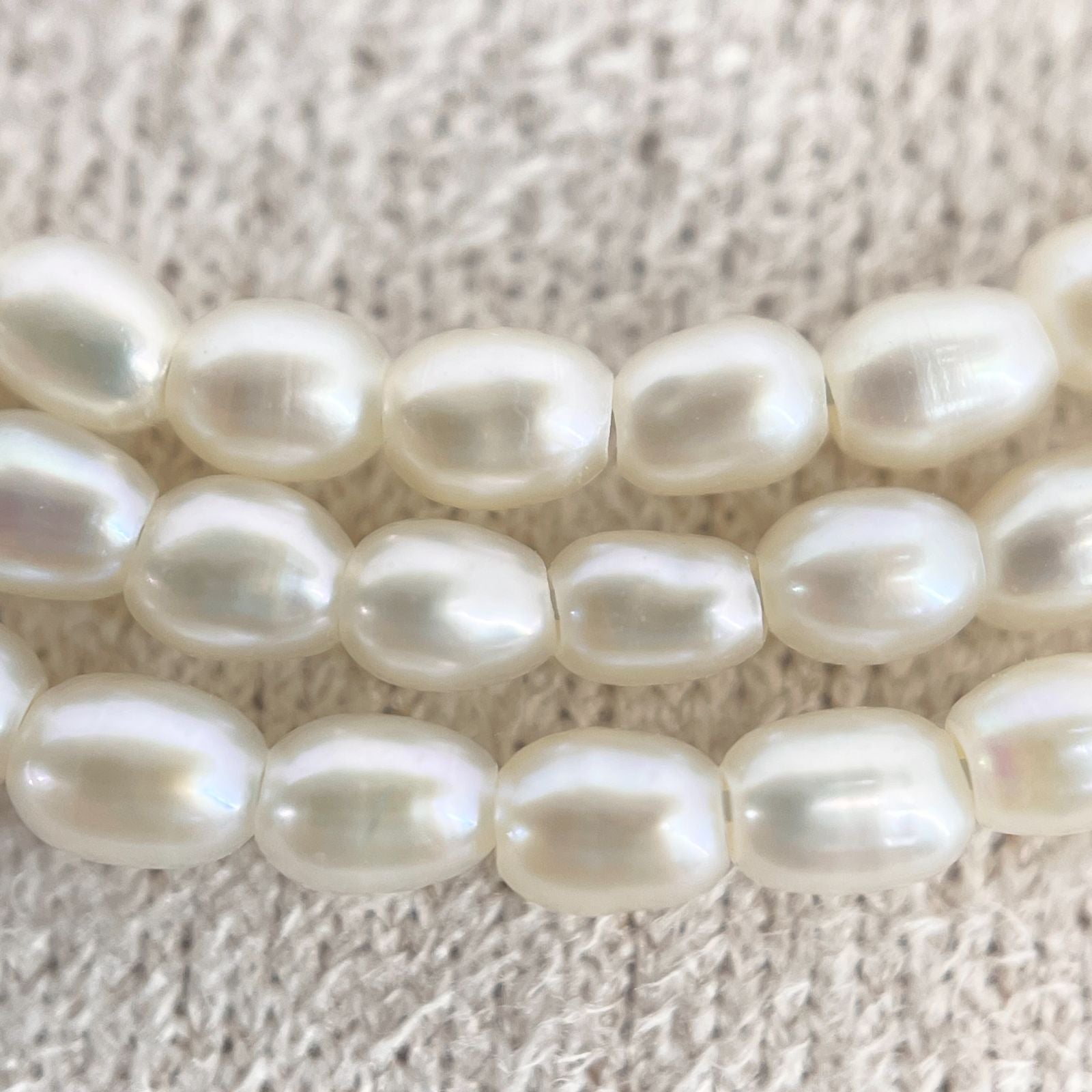 Mikimoto pearl necklace with small freshwater pearls set in K18WG white gold displayed on a white background
