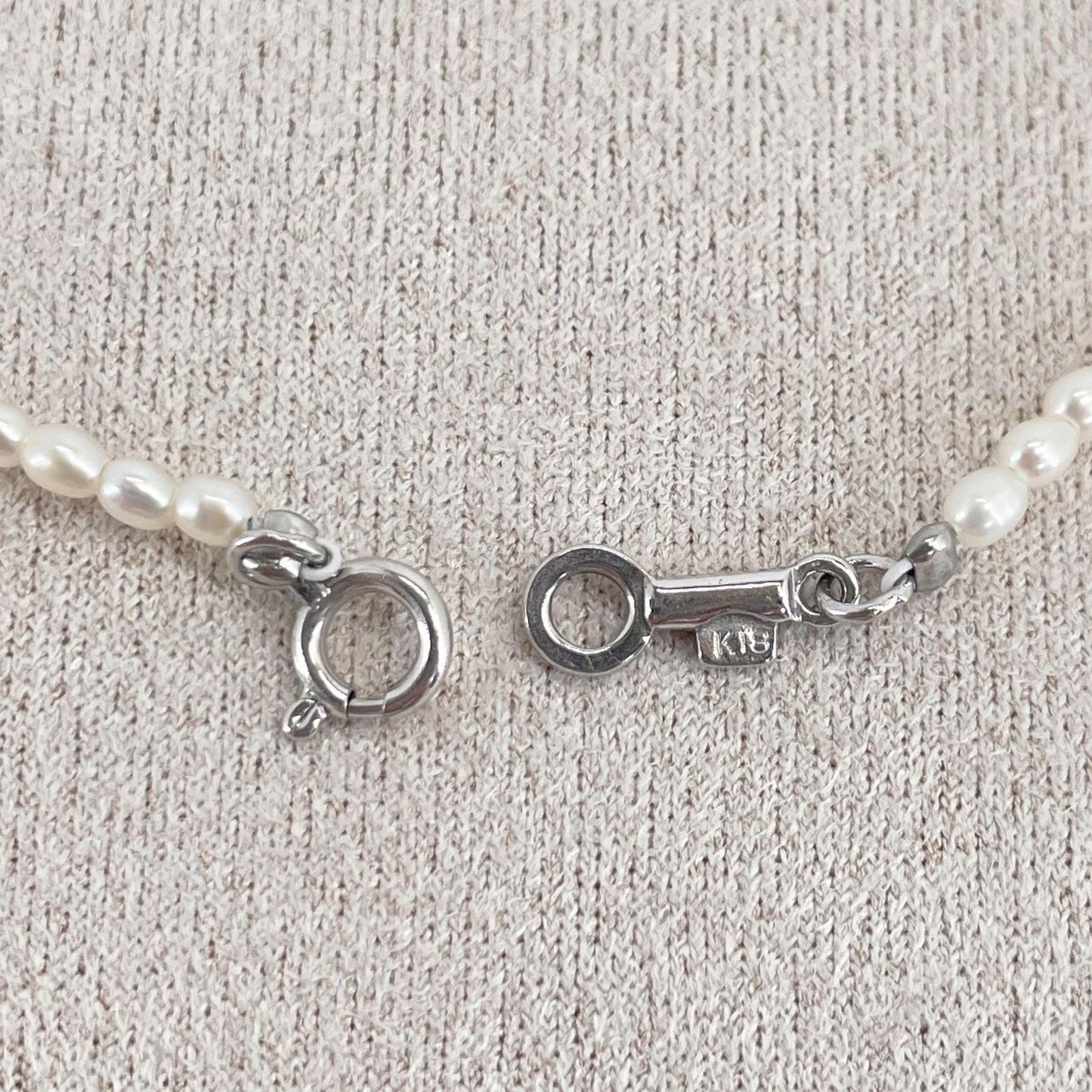 Mikimoto pearl necklace with small freshwater pearls set in K18WG white gold displayed on a white background