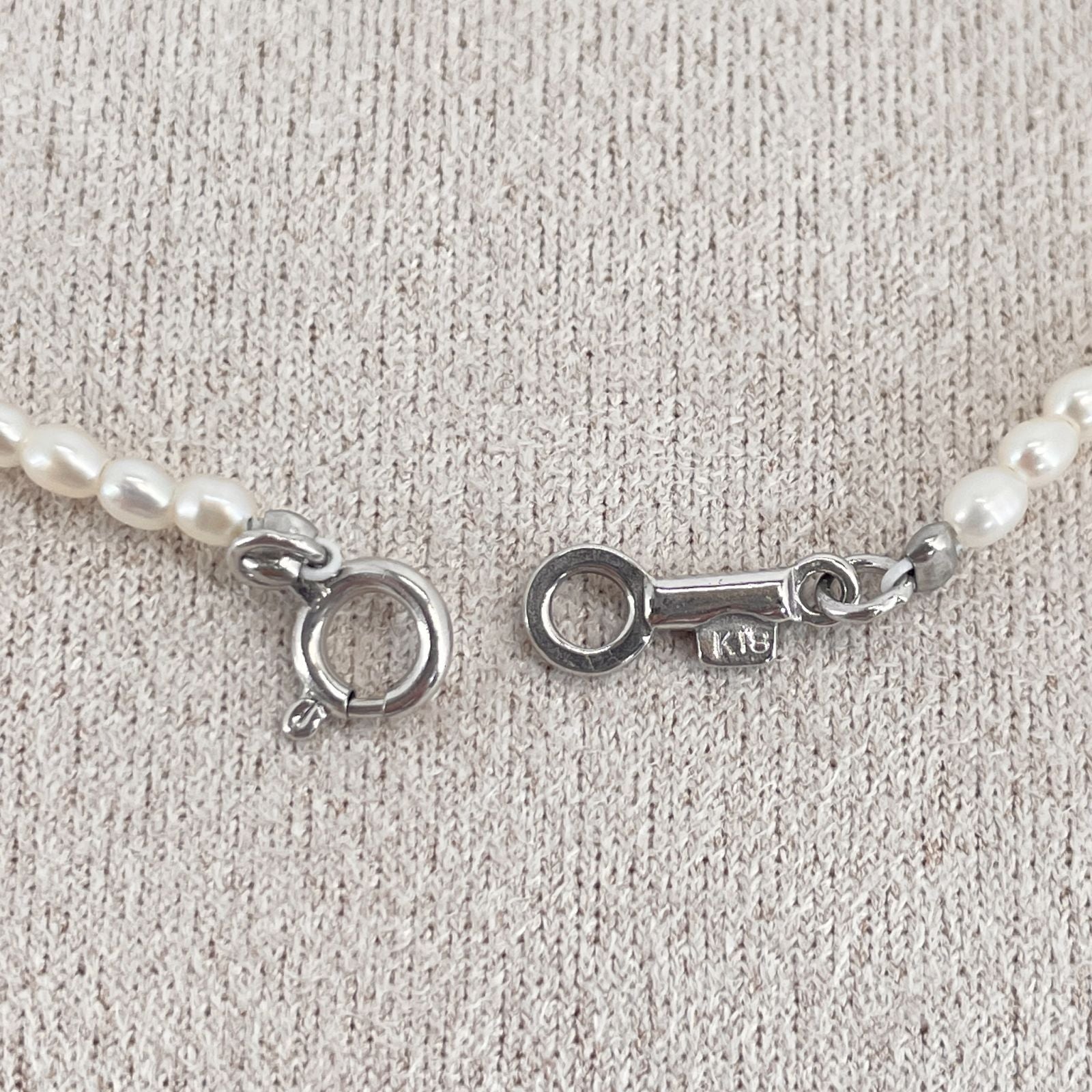 Mikimoto pearl necklace with small freshwater pearls set in K18WG white gold displayed on a white background