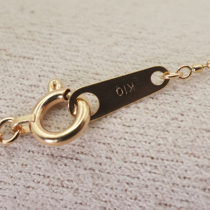 Close-up of Agat Ball Chain Necklace in K10 gold with polished beads and clasp