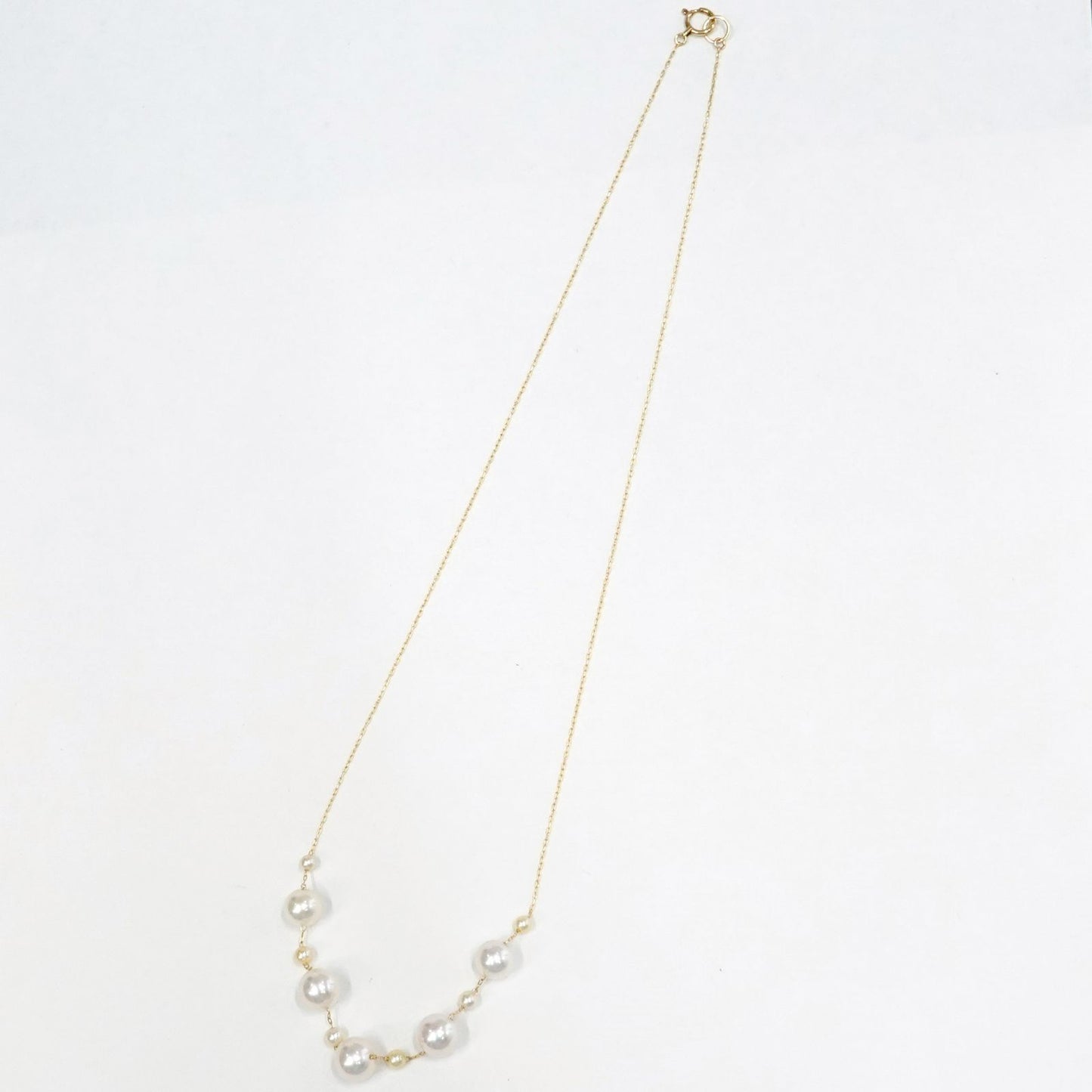 Perlagione Akoya pearl necklace with 7mm pearls and 3mm baby pearls on 44cm K14 yellow gold chain