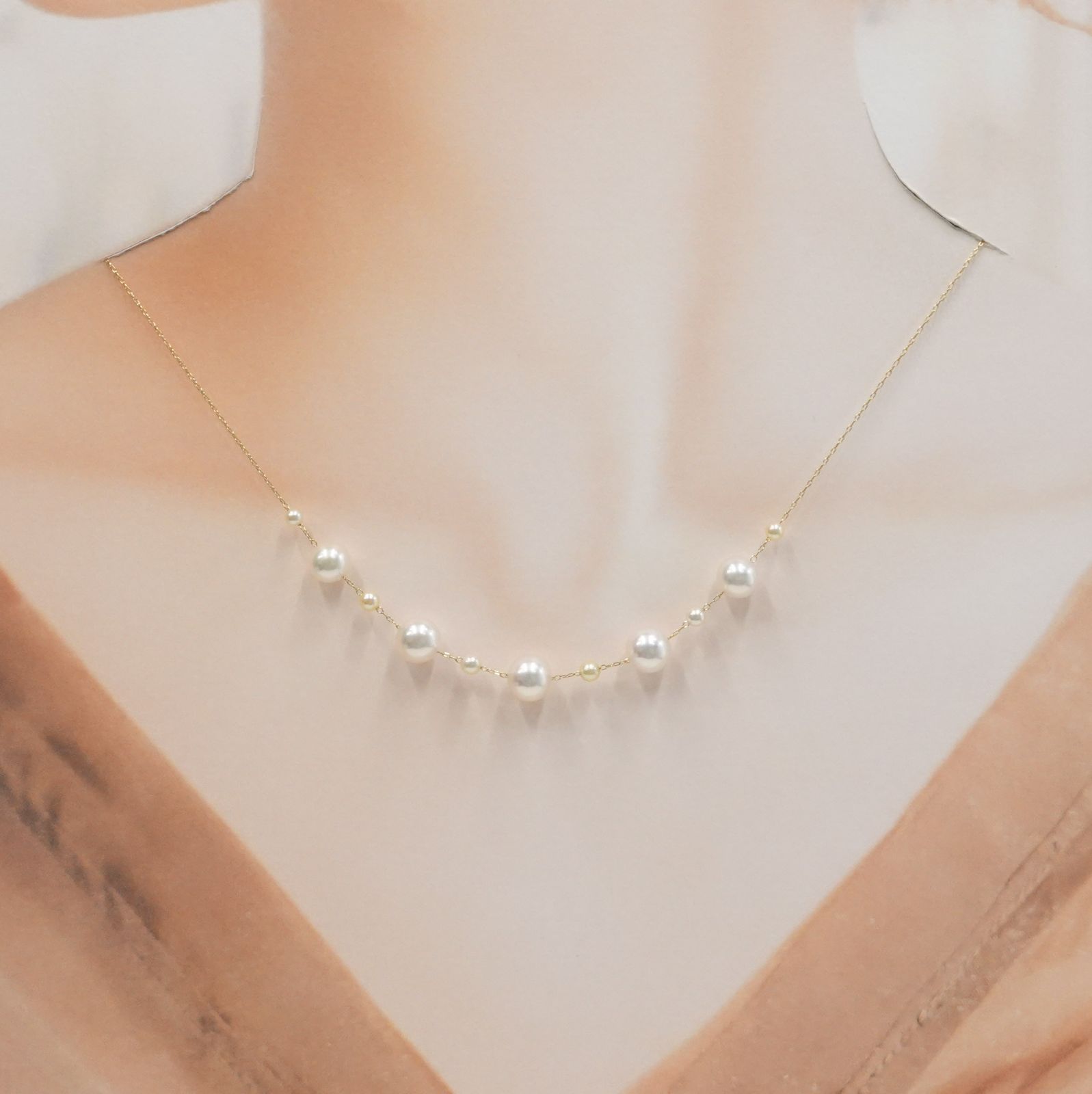 Perlagione Akoya pearl necklace with 7mm pearls and 3mm baby pearls on 44cm K14 yellow gold chain
