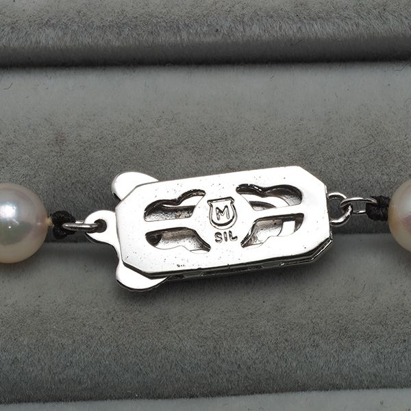Mikimoto silver necklace featuring 6.0-6.4mm pearls measuring about 42 cm in length
