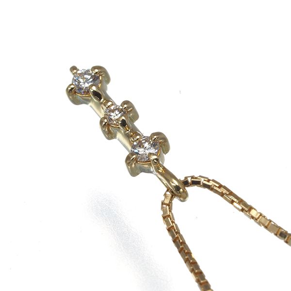 Tasaki 18K yellow gold necklace with three 0.05ct diamonds, 36 to 40 cm length, delicate 10x3.2 mm design