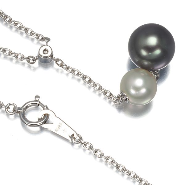 Mikimoto necklace with 9.4mm black pearl, 7.3mm Akoya pearl, diamonds, and white gold chain