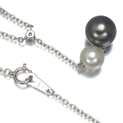 Mikimoto necklace with 9.4mm black pearl, 7.3mm Akoya pearl, diamonds, and white gold chain