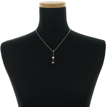 Mikimoto necklace with 9.4mm black pearl, 7.3mm Akoya pearl, diamonds, and white gold chain