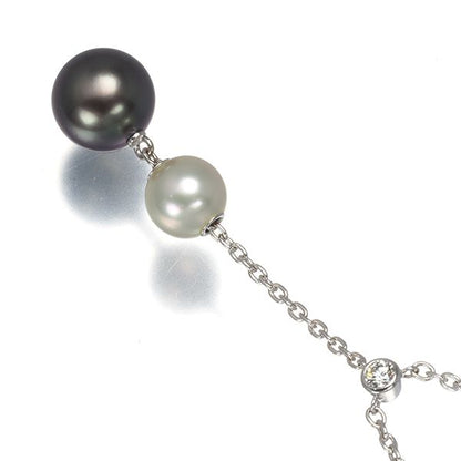 Mikimoto necklace with 9.4mm black pearl, 7.3mm Akoya pearl, diamonds, and white gold chain