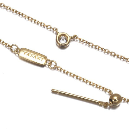 Tasaki necklace with 0.06ct diamond and single pearl in 18k yellow gold, 42cm length