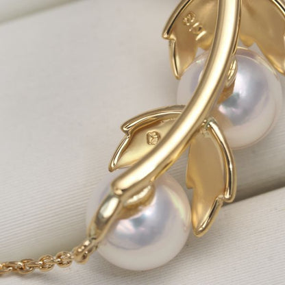 Mikimoto necklace featuring 5.8mm Akoya pearls with a leaf-shaped K18 yellow gold pendant, 48cm length