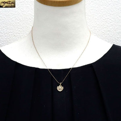 Agete K10PG pendant necklace with seed pearl center and diamond side stones on a 40.5 cm chain