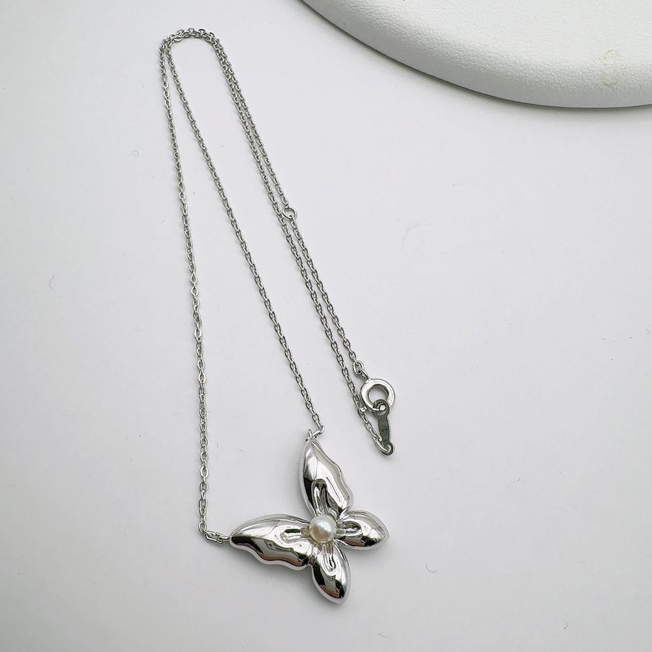 Mikimoto Butterfly necklace featuring sterling silver and 4mm pearl on a 43cm chain