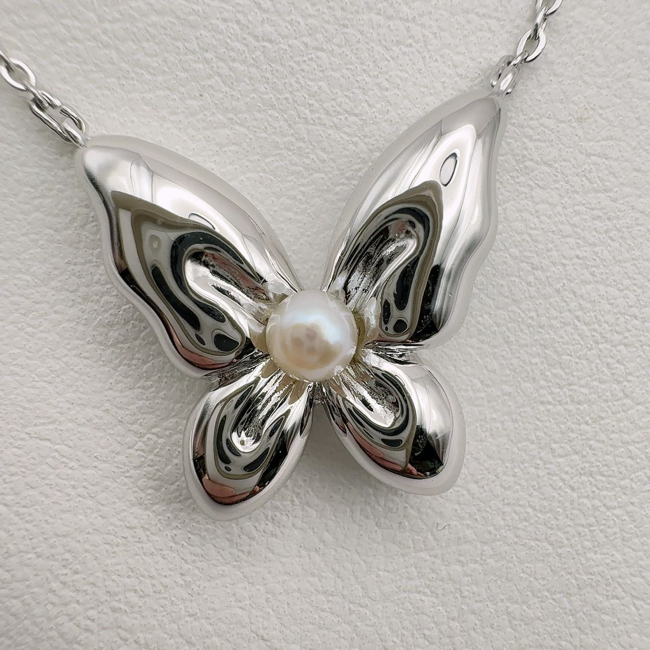 Mikimoto Butterfly necklace featuring sterling silver and 4mm pearl on a 43cm chain
