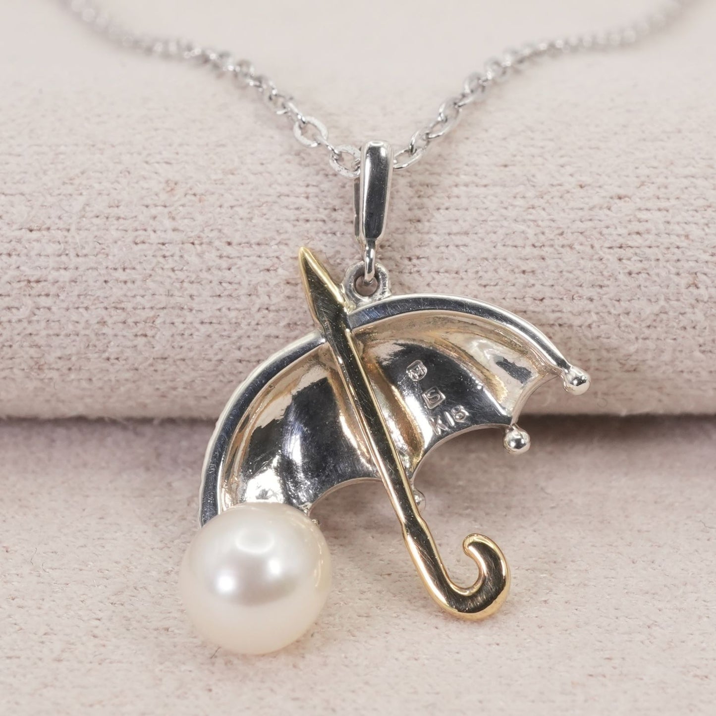 Mikimoto umbrella-shaped necklace in silver and K18 featuring a single pearl