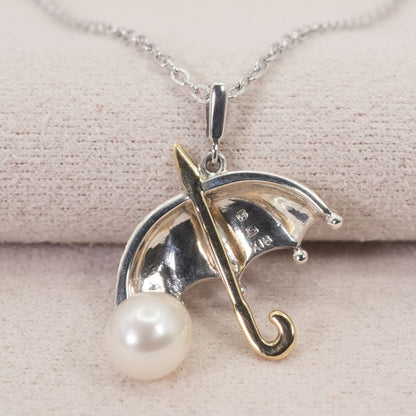 Mikimoto umbrella-shaped necklace in silver and K18 featuring a single pearl
