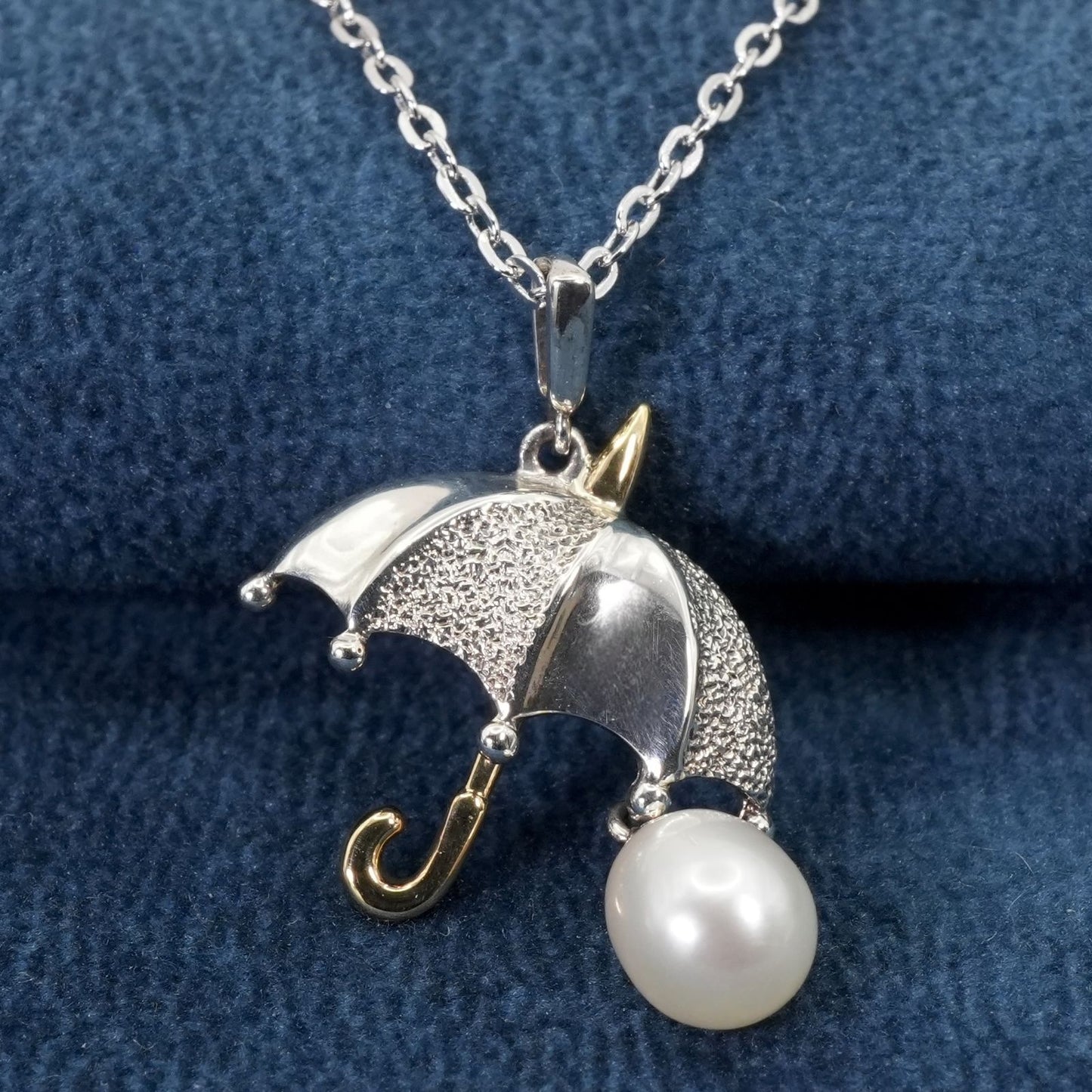Mikimoto umbrella-shaped necklace in silver and K18 featuring a single pearl