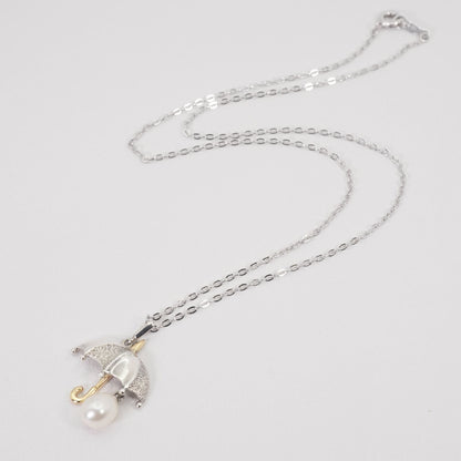 Mikimoto umbrella-shaped necklace in silver and K18 featuring a single pearl