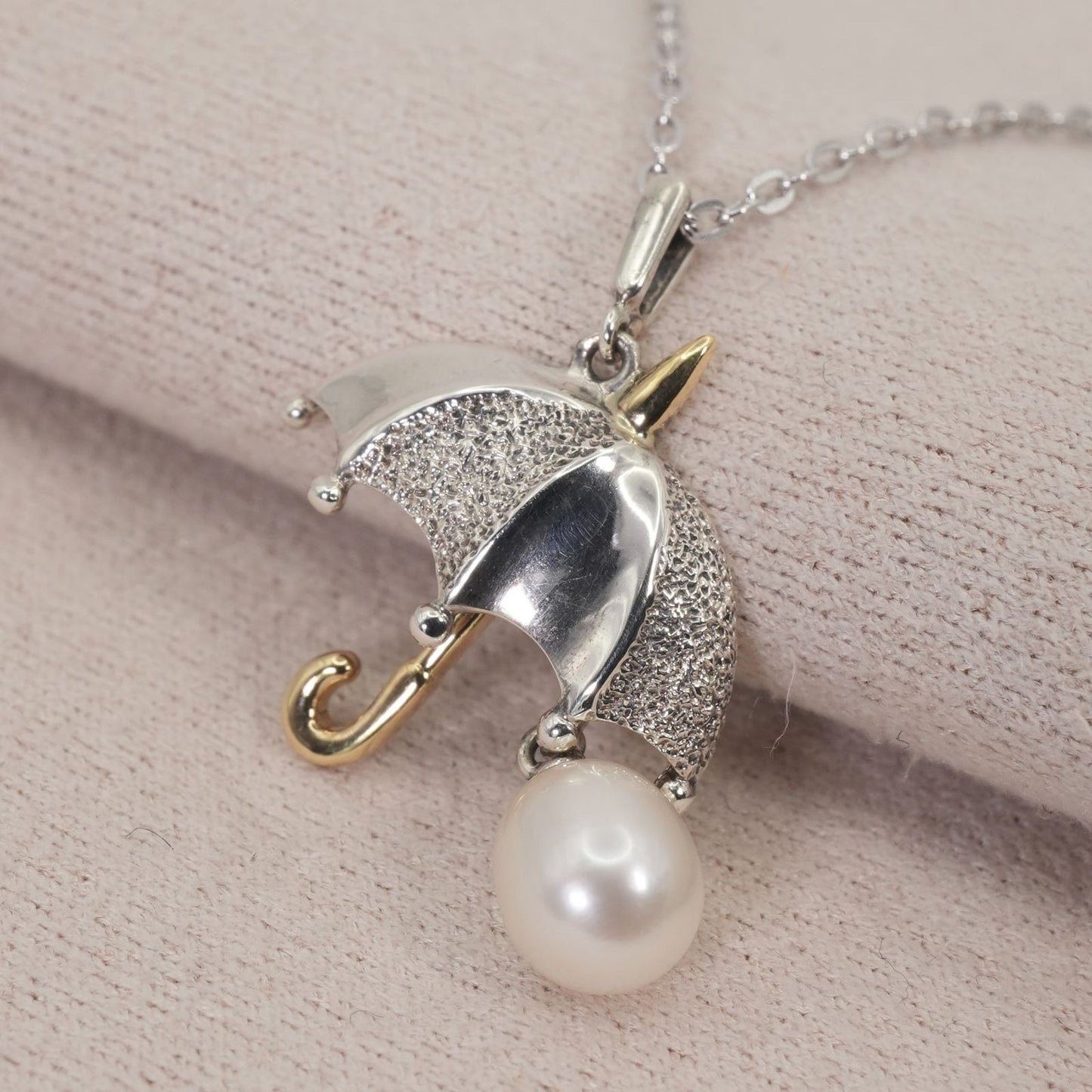 Mikimoto umbrella-shaped necklace in silver and K18 featuring a single pearl