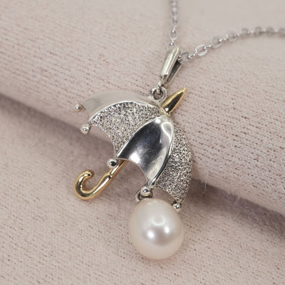 Mikimoto umbrella-shaped necklace in silver and K18 featuring a single pearl