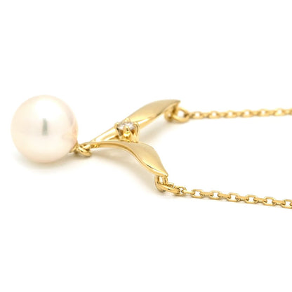 Mikimoto pearl necklace with white pearls and yellow gold V-shape pendant, mid-size length