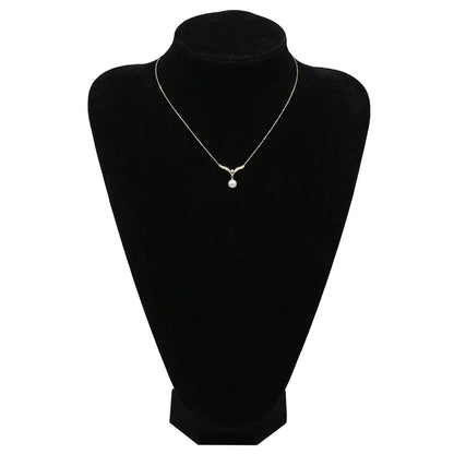 Mikimoto pearl necklace with white pearls and yellow gold V-shape pendant, mid-size length