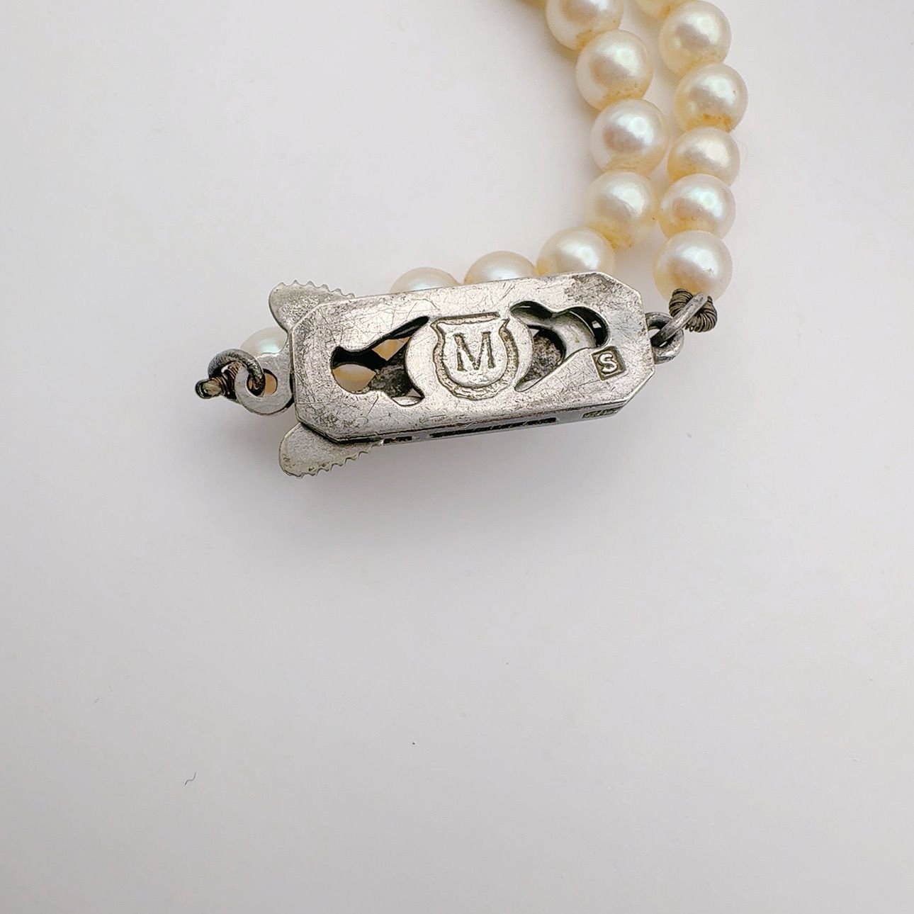 Mikimoto Necklace with 3.7-7 mm pearls and 45 cm chain displayed on a white background