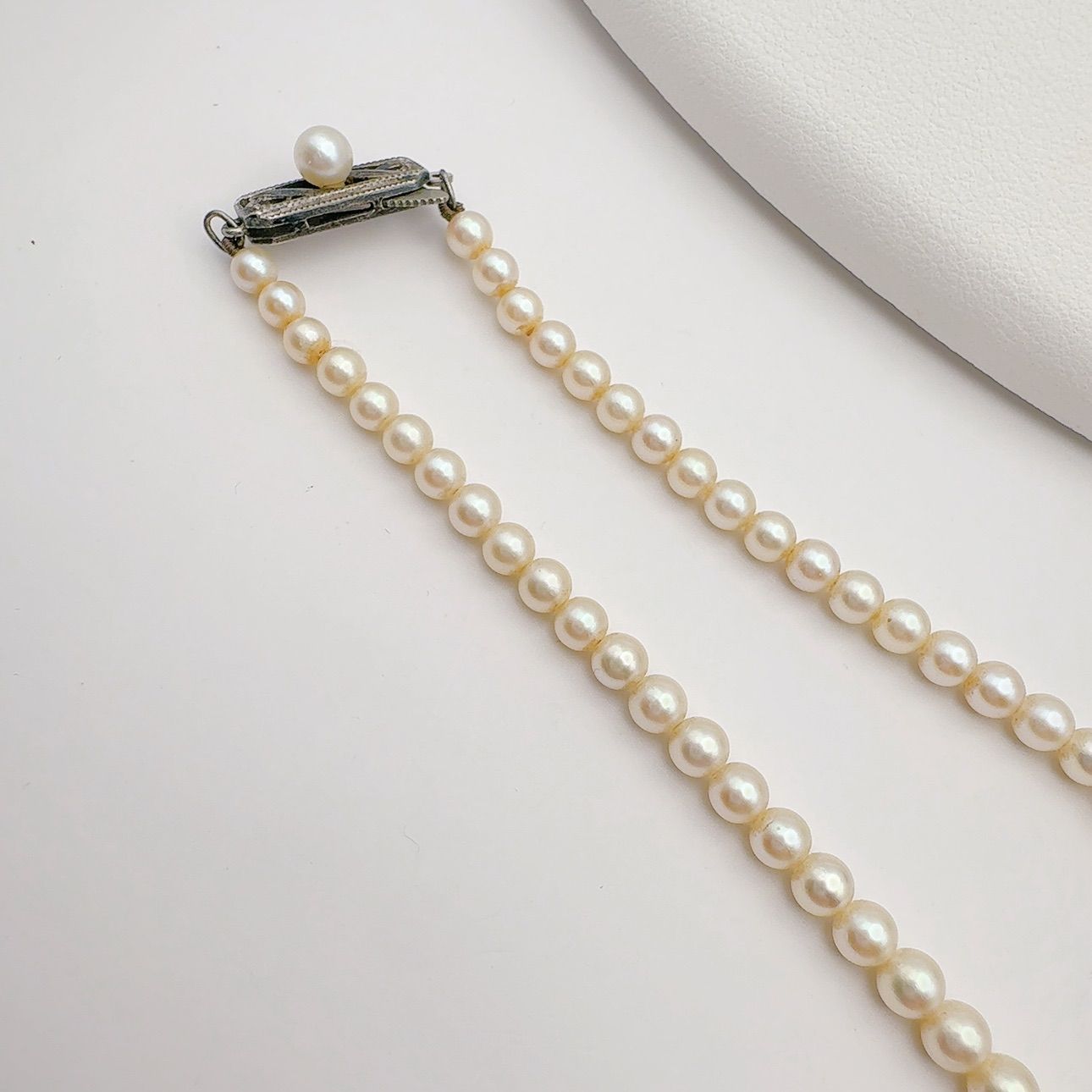 Mikimoto Necklace with 3.7-7 mm pearls and 45 cm chain displayed on a white background