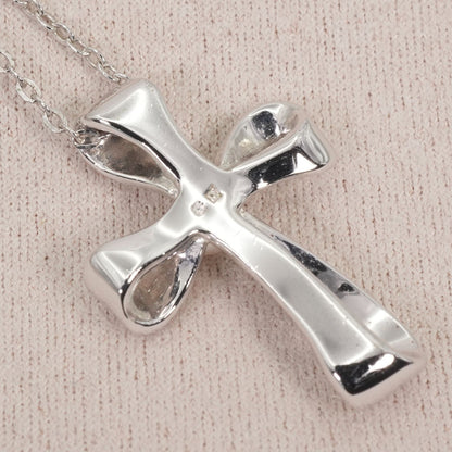 Mikimoto silver necklace with a baby pearl cross pendant, showcasing delicate craftsmanship and polished finish
