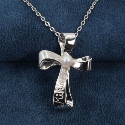 Mikimoto silver necklace with a baby pearl cross pendant, showcasing delicate craftsmanship and polished finish