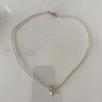 389 Mikimoto Perlite necklace with silver chain and white pearl pendant, 42 cm length