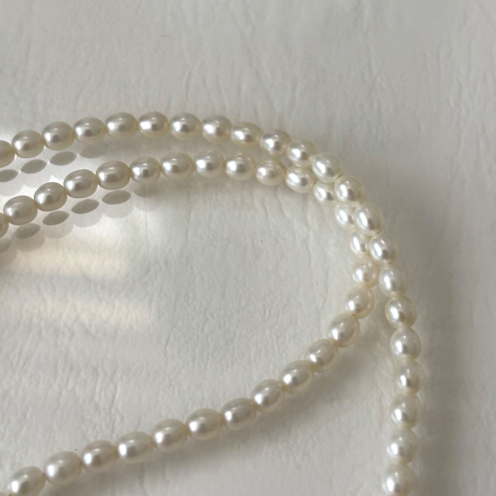 389 Mikimoto Perlite necklace with silver chain and white pearl pendant, 42 cm length