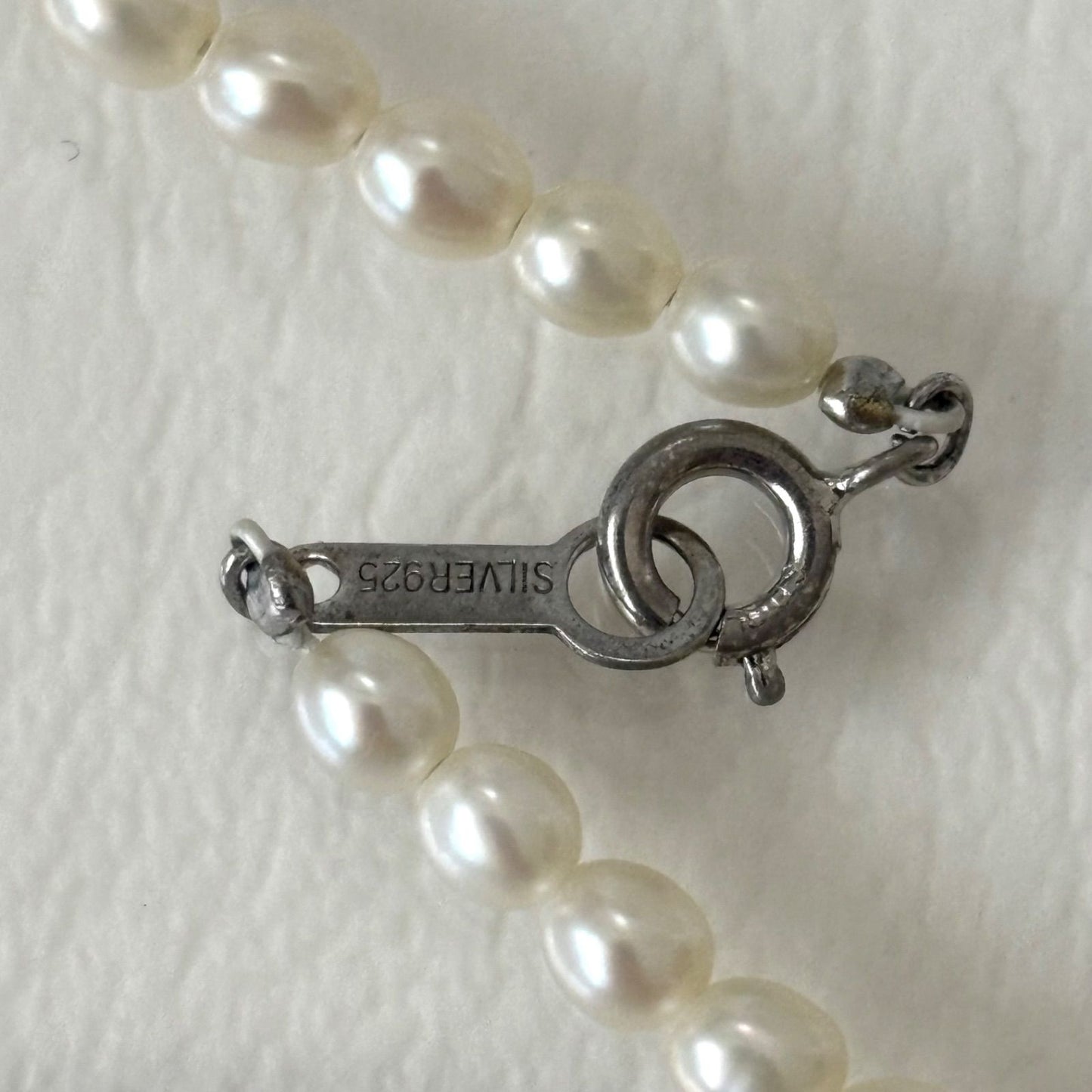 389 Mikimoto Perlite necklace with silver chain and white pearl pendant, 42 cm length