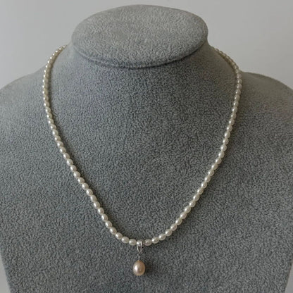 389 Mikimoto Perlite necklace with silver chain and white pearl pendant, 42 cm length