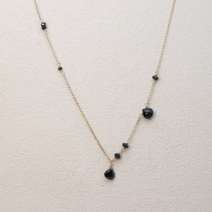 Agete K10 gold necklace with black onyx and slide adjuster on a white background