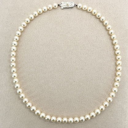 Mikimoto Akoya Pearl Silver Necklace model 24-2988 displayed with pearls and silver chain in jewelry box