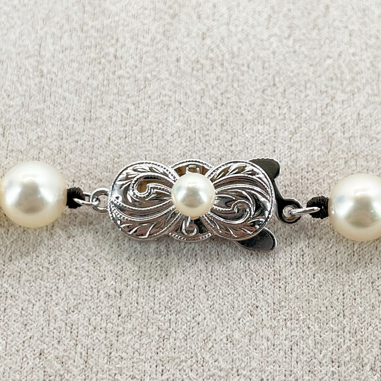 Mikimoto Akoya Pearl Silver Necklace model 24-2988 displayed with pearls and silver chain in jewelry box